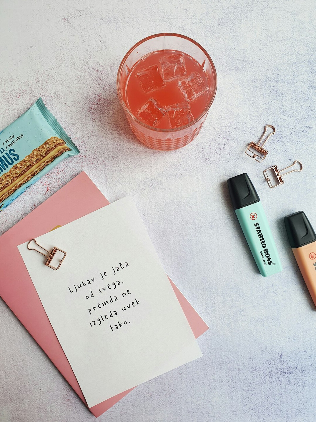 Printed bar charts and a notebook on a bright desk