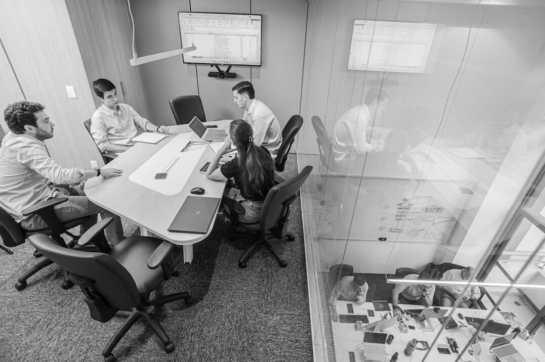 diverse group of people discussing in meeting room
