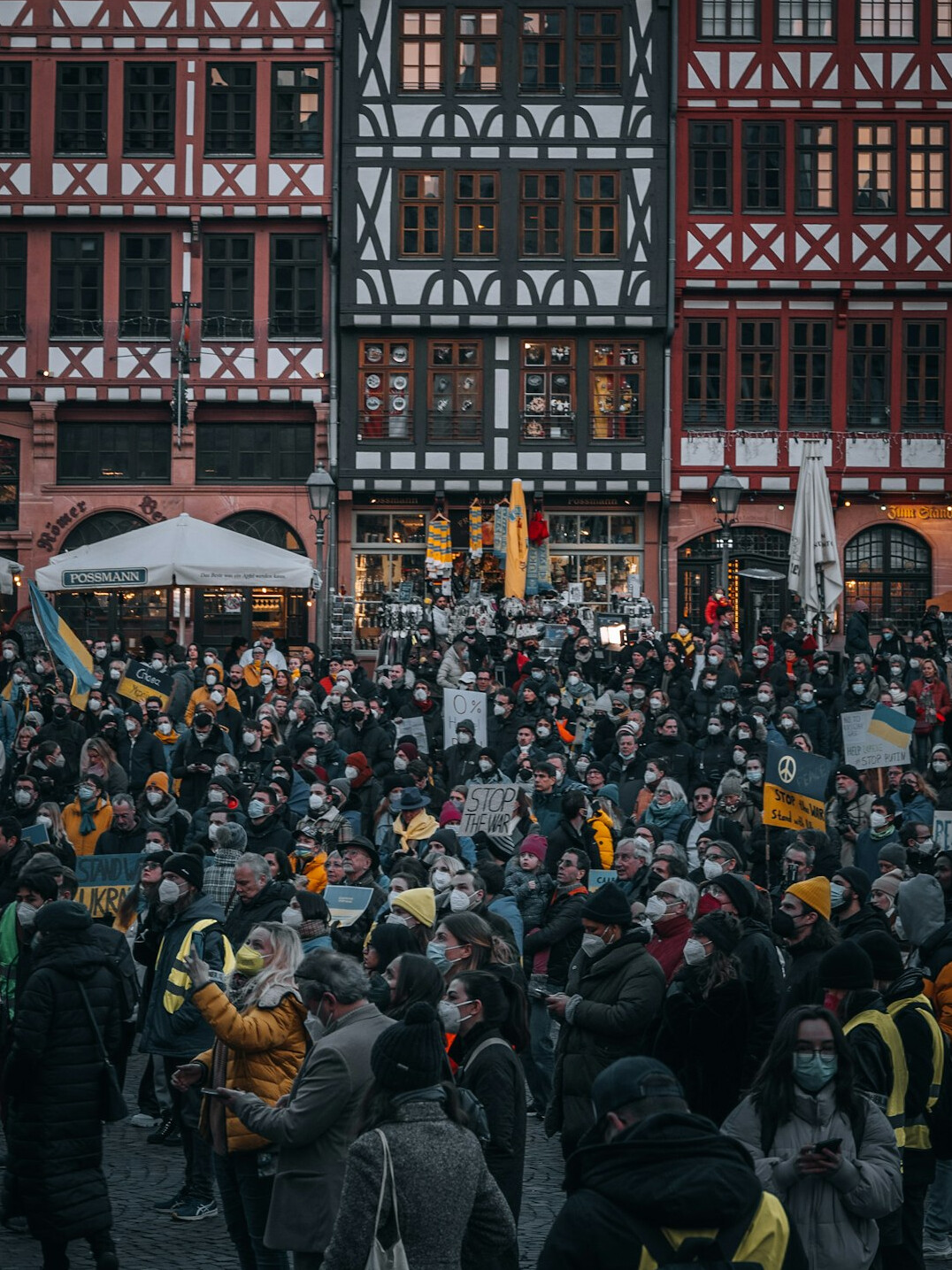 german city street with multicultural crowd