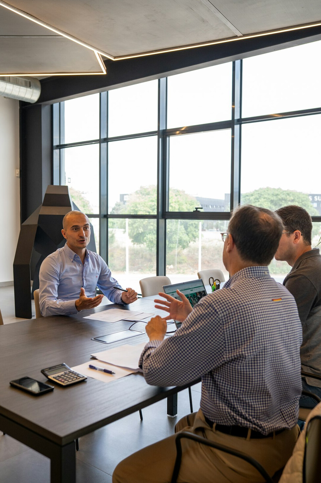 diverse group of people discussing in meeting room