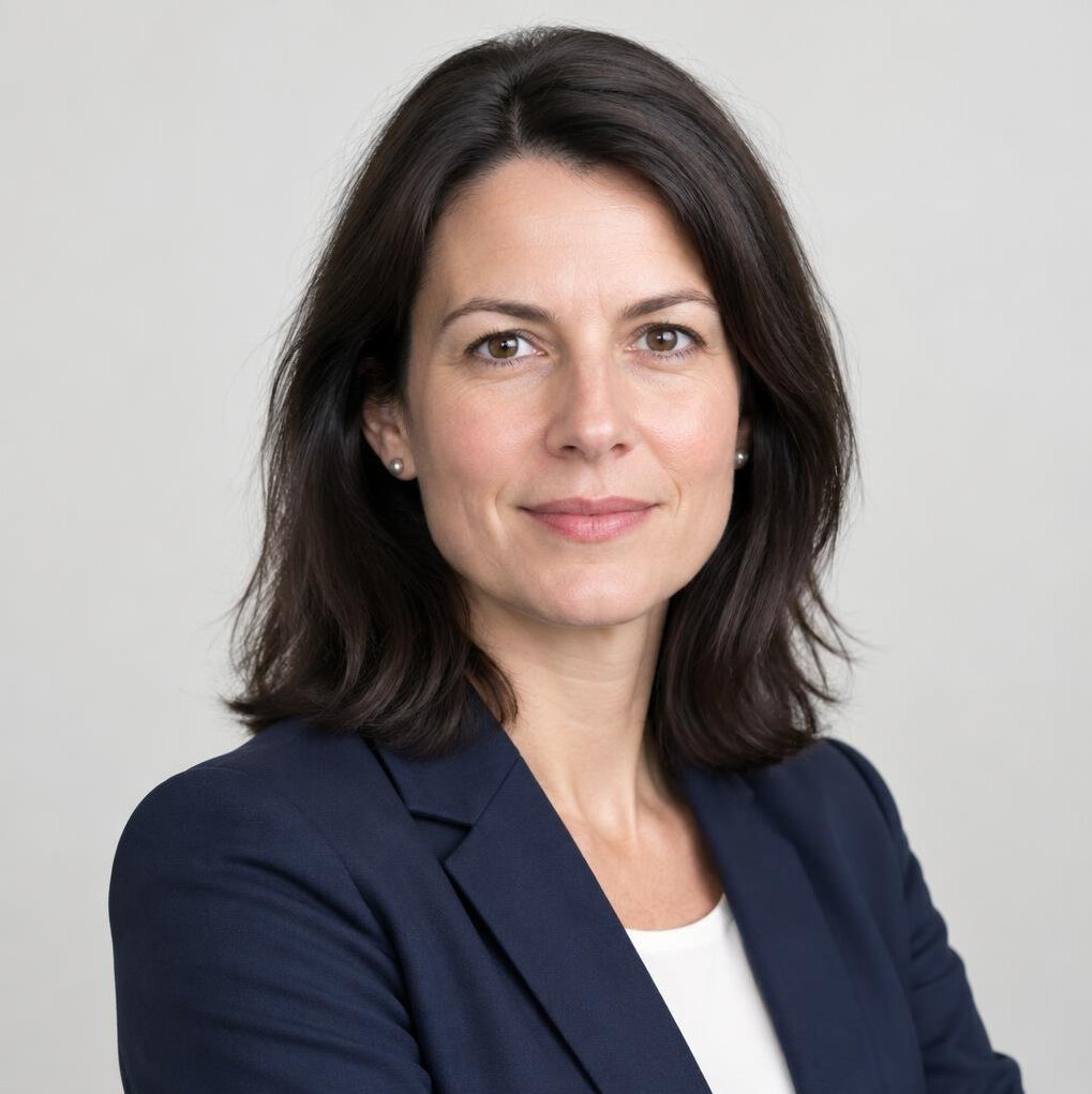 Professional portrait of a woman researcher in a bright office